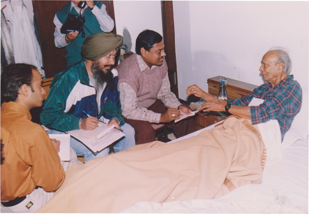 Naushad Sahib, in conversation with Mehtab-Ud-Din (with dark red trousers and close to Naushad Sahib), Sardool Singh Abravan and Anoop Kumar.