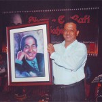 Mohd Rafi Portrait being handed over by Artist C.S. Pant to Binu Nair of Rafi Foundation